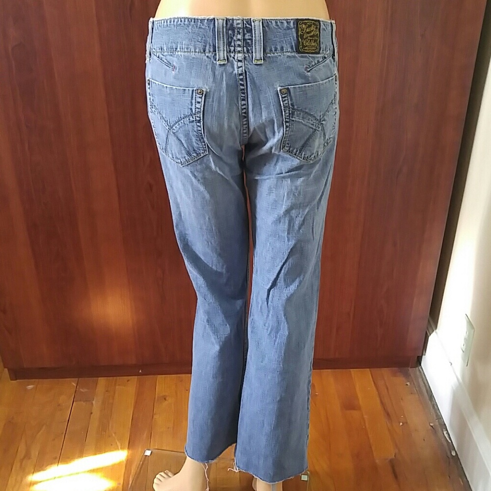 Lucky Brand unfinished hem distressed jeans size 4/27